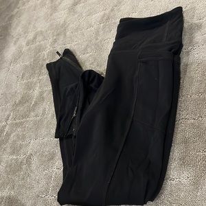 Size small Athleta black leggings with zipper detail on ankles